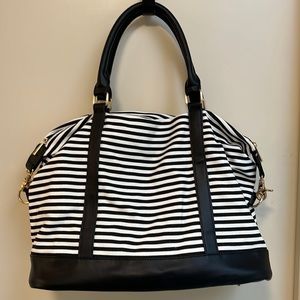 Weekender bag black and white striped with black interior.
